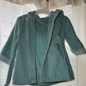 frog bath, size 0-9 months, pistachio green color, has two frog eyes